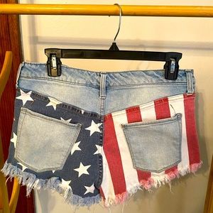 Cut-off Jean Shorts with Frayed Patriotic American Flag back pockets. Size 8/29.